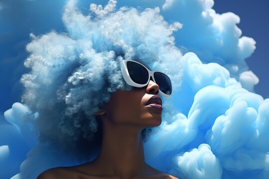 Close-up portrait young afro woman with blue hair, trendy hairstyle in the shape of a cloud against the sky. Stylish model with sunglasses. Bold surreal image.