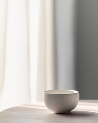Fototapeta na wymiar Serenely Lit Interior with a Simple White Bowl