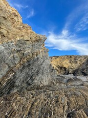 sandstone rock in the blue sky background, ocean rocky coast