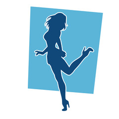 Silhouette of a female dancer wearing mini skirt in action pose. Silhouette of a slim woman dancing happily.