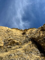 sandstone rock in the blue sky background, ocean rocky coast