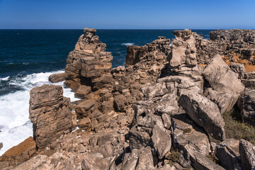 Rock formations in the site of geological interest of the cliffs of the Peniche peninsula, portugal, in a sunny day.