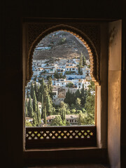 View of the Albaicin district of Granada, Spain, from an arched window in the Alhambra palace