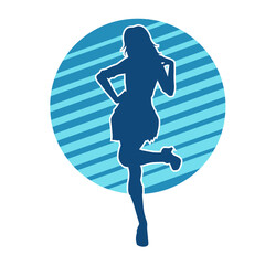 Silhouette of a female dancer wearing mini skirt in action pose. Silhouette of a slim woman dancing happily.