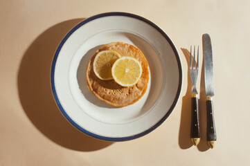 Plant based vegan  lemon whole wheat pancakes top view sunny shot