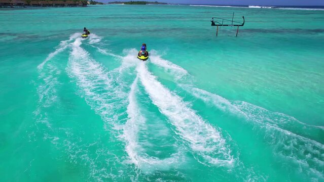 Maldives - Jet Ski - Kanifinolhu Island - Aerial view with the drone of 2 jet skis in the lagoon