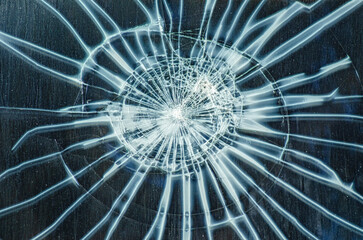 detail of an impact on a window glass, broken glass pane