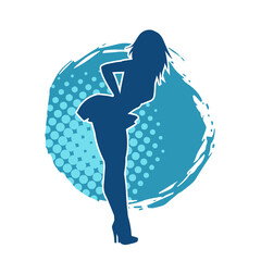 Silhouette of a female dancer wearing mini skirt in action pose. Silhouette of a slim woman dancing happily.