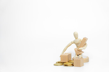 Wooden doll with wooden toy block isolated on white background. business or creative concept