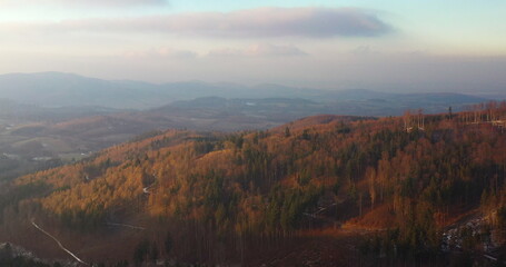 aerial view of woods and mountains in winter