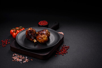 Delicious grilled chicken legs with spices and herbs in teriyaki sauce