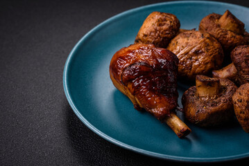 Delicious grilled chicken legs with spices and herbs in teriyaki sauce