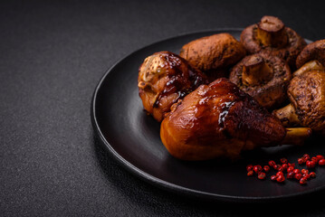 Delicious grilled chicken legs with spices and herbs in teriyaki sauce