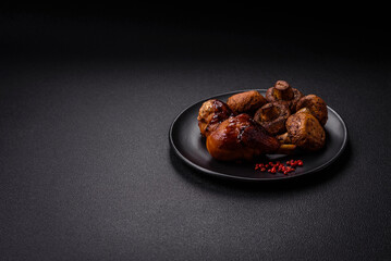 Delicious grilled chicken legs with spices and herbs in teriyaki sauce