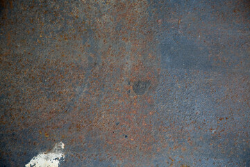 Weathered iron wall with seamless background of iron products