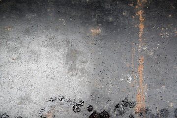 Weathered iron wall with seamless background of iron products