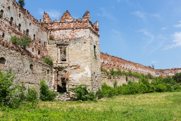 Fototapeta na wymiar Ruins of brick defense tower and wall of mediaeval castle