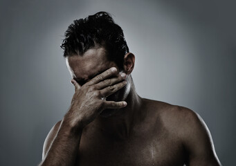 Man, hand and face hiding in studio for embarrassed shame on grey background or topless, unhappy or...
