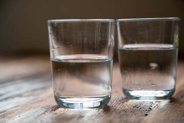 Water glass, water, holding a water glass