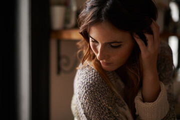 Lonely, depression and young woman at a home with upset, grief and mad facial expression for...