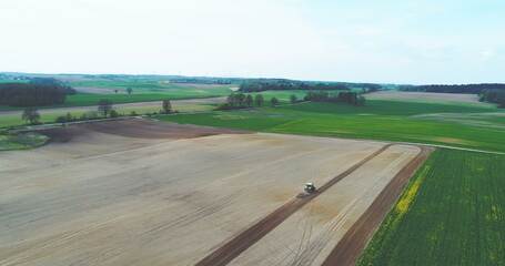 Tractor Plowing Field