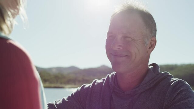 Father Joyfully Putting The Life Jacket On His Daughter Before The Ride