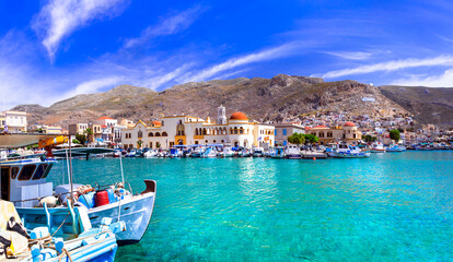 Scenic traditional greek isalnds.   Kalymnos island in Dodecanese. Pothia town and harbor  with fishing boats. Greece travel - obrazy, fototapety, plakaty