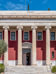 Fototapeta premium Partial view of the columns of Gennadius Library facade. .On the front is written a quote of Isocrates: 