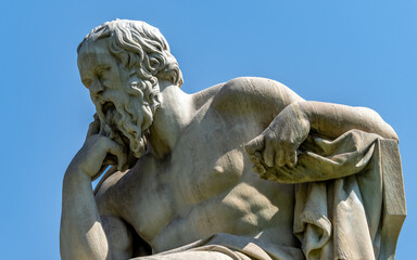Socrates marble statue, the ancient Greek philosopher, isolated on a clear blue sky background....