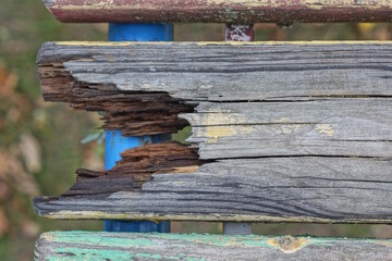 one old gray wooden round broken board on a table outdoors
