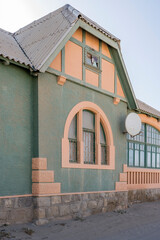 picturesque old green-grey building at historical town, Luderitz,  Namibia