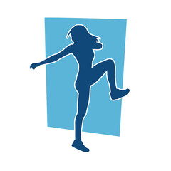 Silhouette of slim female doing exercise. Silhouette of a sporty woman doing gym workout pose. 