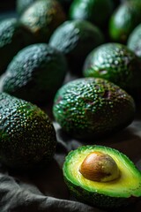 Fresh ripe avocados on a wooden background. Selective focus.