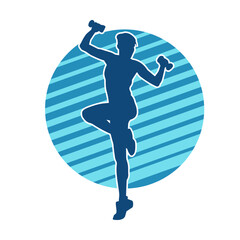 Silhouette of slim female doing exercise. Silhouette of a sporty woman doing gym workout pose. 