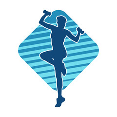 Silhouette of slim female doing exercise. Silhouette of a sporty woman doing gym workout pose. 