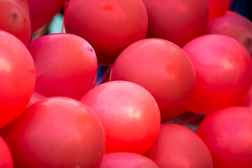 Red balloons for party in the park. Abstract background.