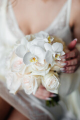 Wedding flowers. Bridal bouquet with exotic flowers. Bride holding a bouquet. wedding details. soft focus