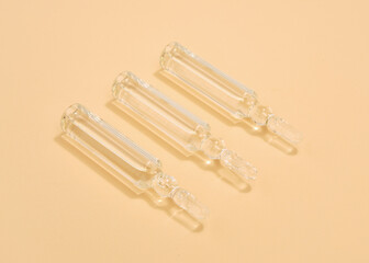 Three glass ampoules of solutions. Body and hair care.