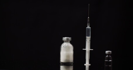 Syringe and Medicine on Black Background Isolated