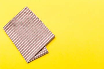 top view with red empty kitchen napkin isolated on table background. Folded cloth for mockup with copy space, Flat lay. Minimal style