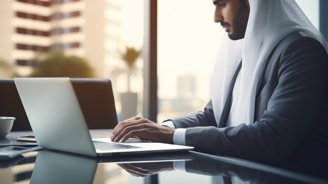 arab man working on a laptop in office