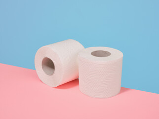 Two rolls of white toilet paper. Cleaning, cleanliness and order.