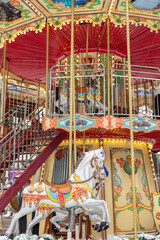 Wooden horse on the fairground. Children's carousel