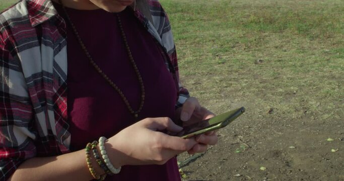 Girl in nature texting