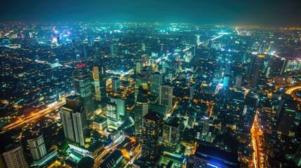 A breathtaking view of a vibrant modern city illuminated by the dazzling lights of the night.