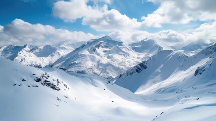 Majestic snowy mountains with rugged peaks reach into the clouds.
