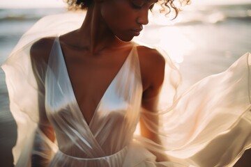 Beautiful black woman in a wedding dress at the beach, modern bride, in analog fashion photography style
