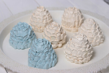 Homemade zephyr spread out on a tray. Spruce cones from zephyr.  Close-up.