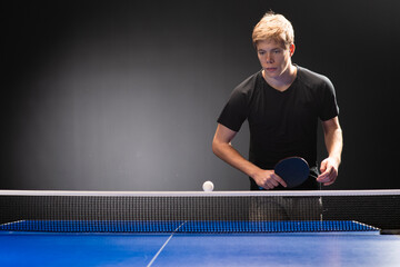 Portrait of young man playing tennis