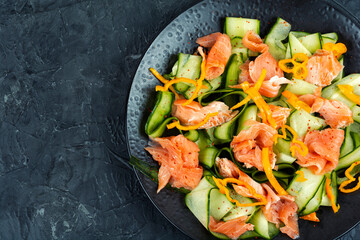 Salted salmon salad with green cucumber.